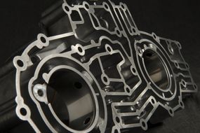 Aluminum Die Cast JD Manifold from Le Sueur Inc. Complex shapes and a smooth aluminum cast finish